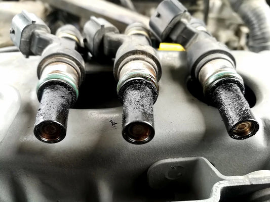 What causes fuel injectors to get clogged or dirty?